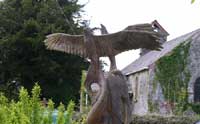 Red Kite carving and the Old Church at Capel Gwynfe